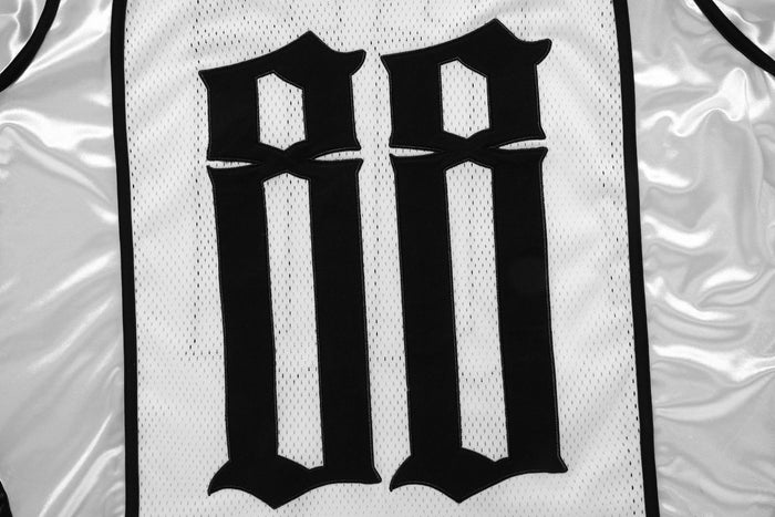 Close-up of back graphic with large black gothic 88 on white mesh jersey