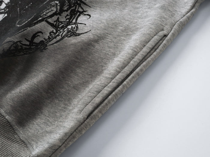 Close-up of gray sleeve and side seam with black print near the cuff