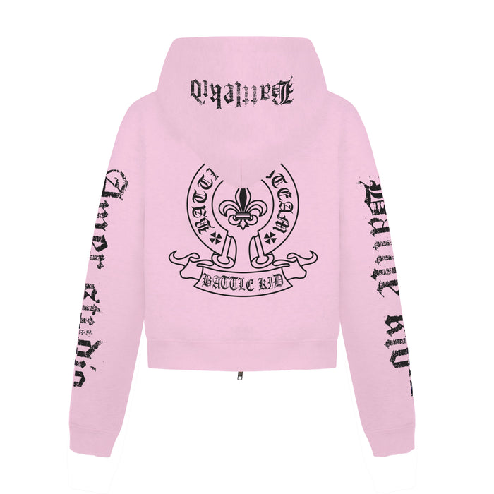 Back view of pink zip-up hoodie with large black crest graphic and gothic lettering on hood