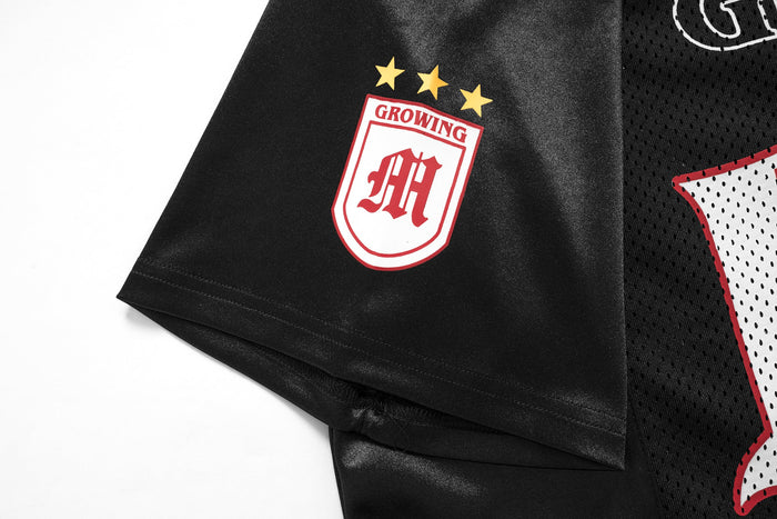 Black gothic mesh football jersey tee with red and white star crest and oversized streetwear details