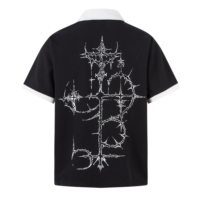 Black polo shirt with white collar and thorny gothic cross graphic on the back, dark streetwear style