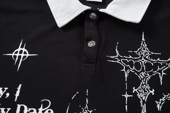 Black gothic polo shirt with white collar, button placket, and thorny cross graphics on textured fabric