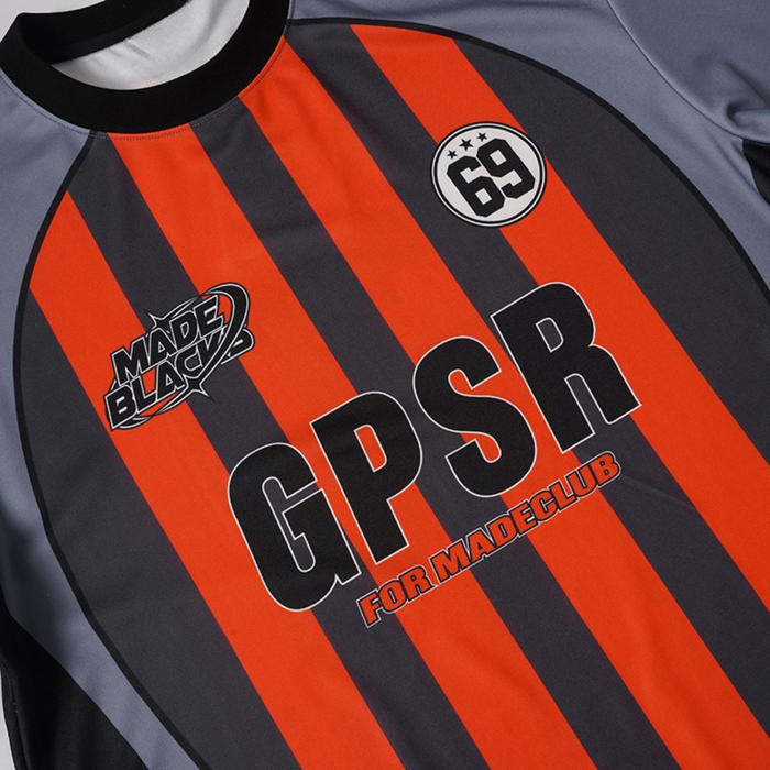 Gray and black football jersey with bold orange vertical stripes, GPSR 69 badge, and Made Black sponsor logo