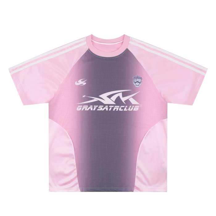 Pink gradient mesh soccer jersey with white shoulder stripes and bold chest graphic on a streetwear tee