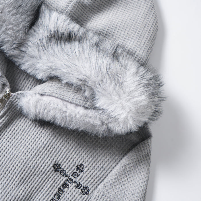 Close-up of the faux fur hood trim and gray waffle knit fabric on the hoodie