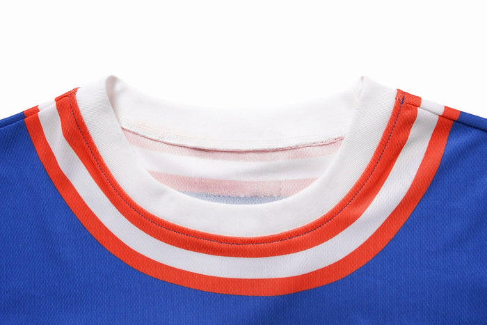 Blue varsity mesh crop jersey with white ribbed collar and red striped trim close-up