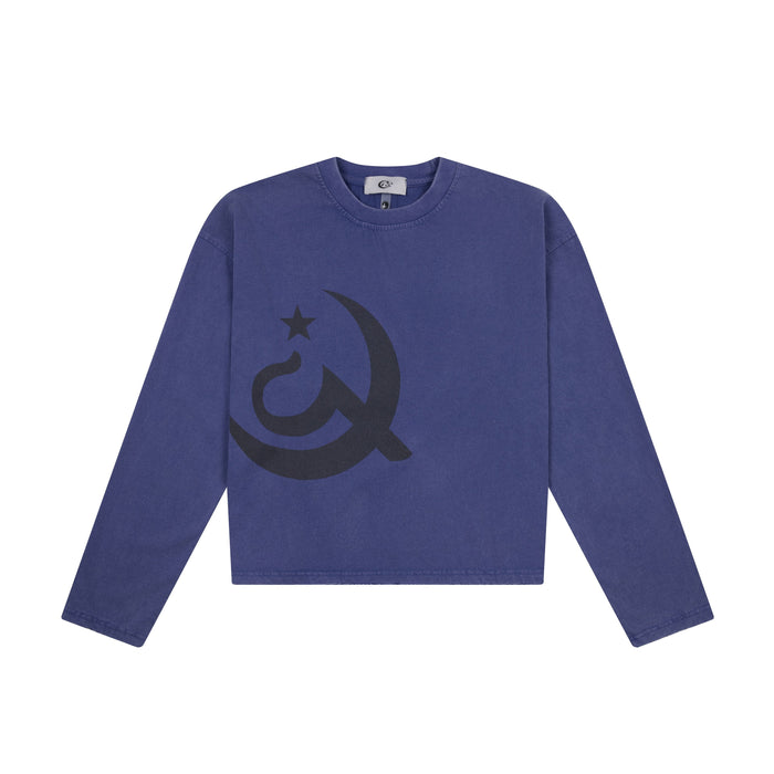 Washed indigo cropped long sleeve tee with oversized dark navy archival emblem graphic on the chest, front view