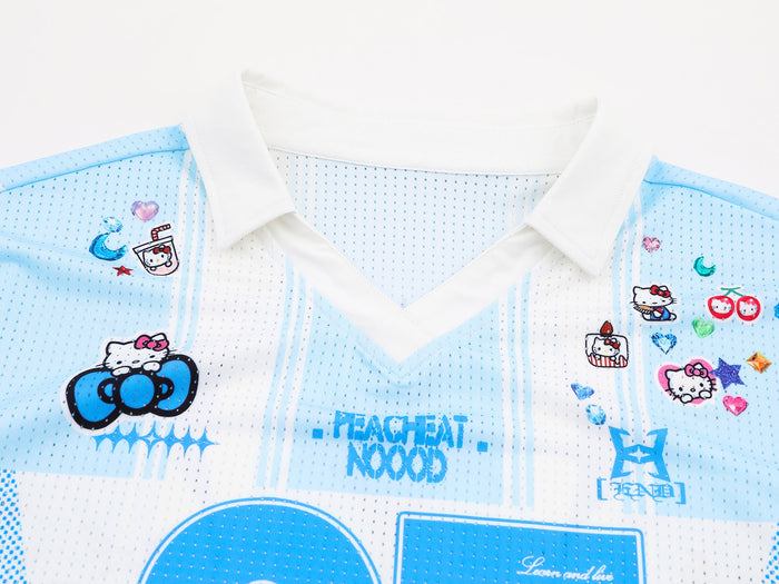 Hello Kitty varsity mesh jersey with white V-neck collar, light blue stripes, and colorful graphic patches
