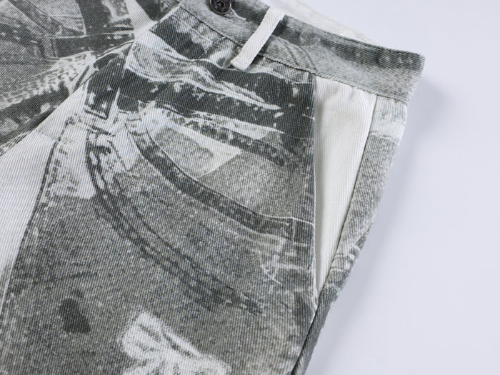 Close-up of gray collage-print pants leg and side seam