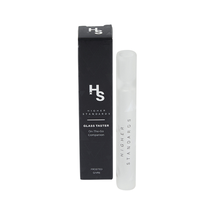 Front view of the Higher Standards Glass Taster standing upright beside its black branded box on a white background.