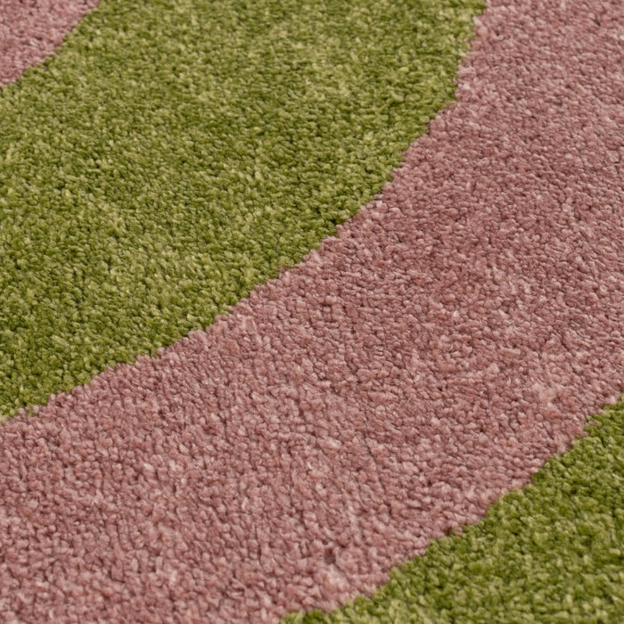 Close-up of a carpet with green and brown stripes