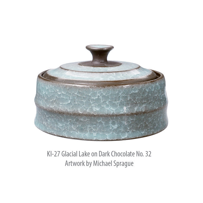 Lidded jar in KI-27 Glacial Lake glaze on Dark Chocolate No. 32 clay, pale blue crackle with dark rims and knob