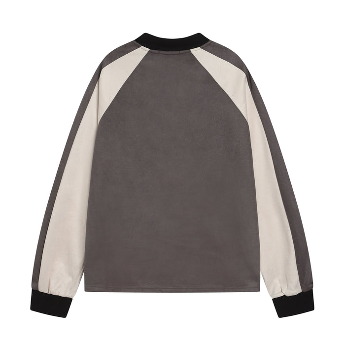 Back view of a gray varsity rugby top with cream shoulder panels and black collar