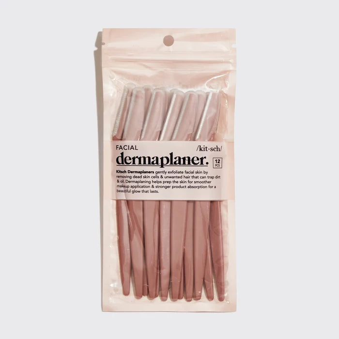 Packaged dermaplaner with clear plastic cover on a light gray background
