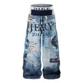Front view of wide-leg graphic denim pants with layered waistband, distressed print, and lion motif in washed blue