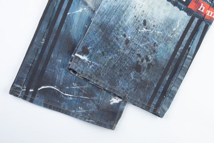 Close-up of hem on dark blue printed denim pant leg with stripe detail
