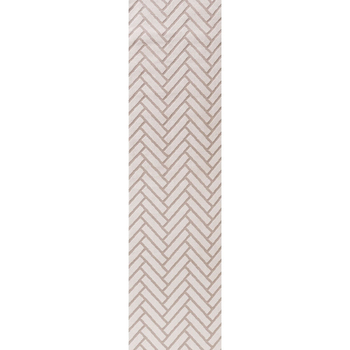 Beige and white geometric patterned rug on a plain background