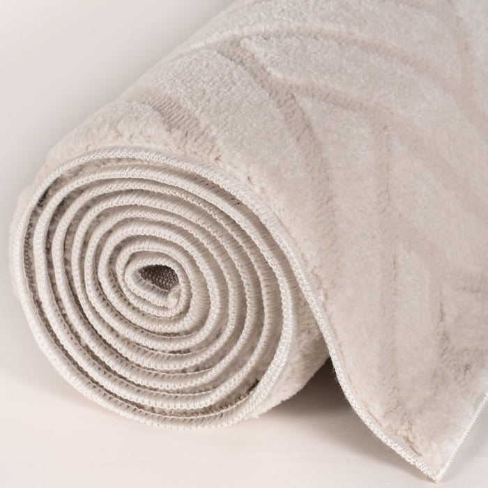 Rolled-up beige carpet on a light gray background