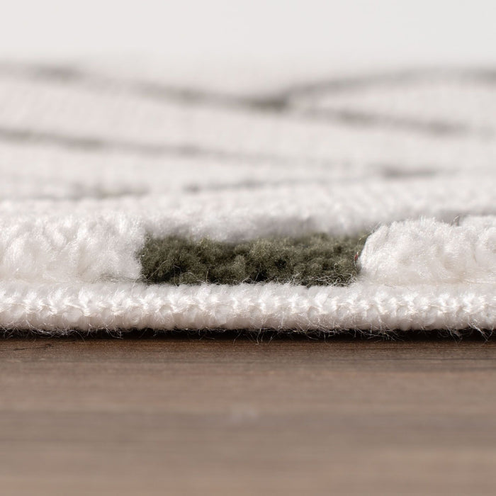 Close-up of a textured white rug on a wooden floor