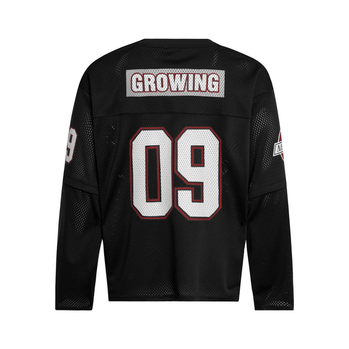 Black mesh hockey jersey back with large white 09 and GROWING patch