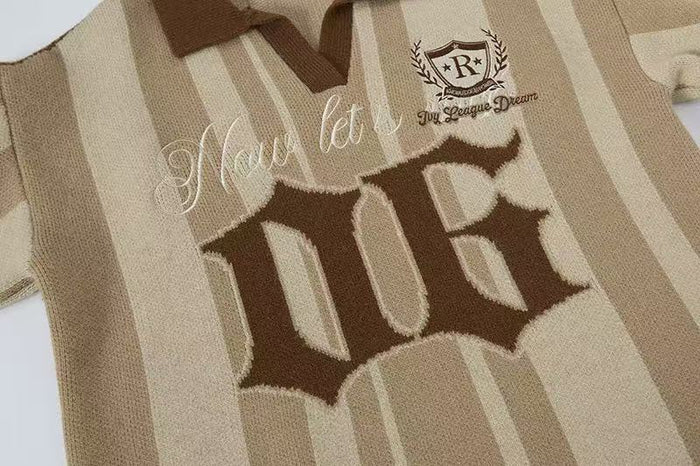 Close-up of the front graphic on a beige striped knit polo sweater with large '06 lettering