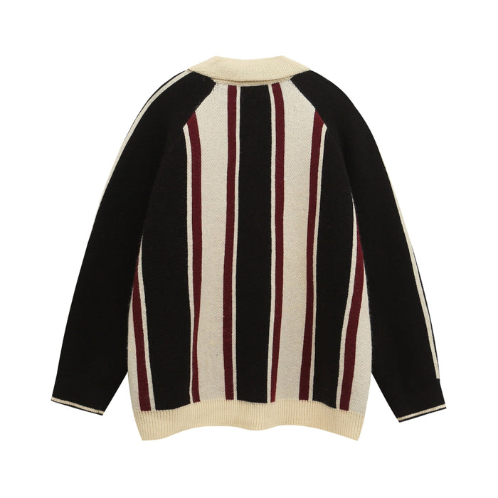 Front view of a knit sweater with black and cream vertical stripes and burgundy accents