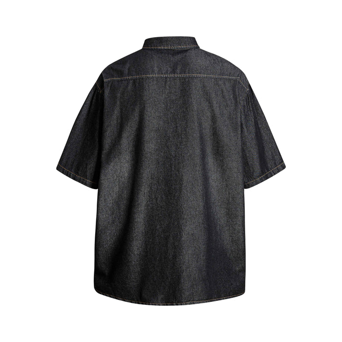 Dark denim short-sleeve button-up shirt shown from the back with a relaxed streetwear fit and contrast stitching
