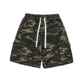 Men's baggy woodland camo cargo shorts with elastic drawstring waist, flap cargo pockets, and white contrast topstitching laid flat on white background