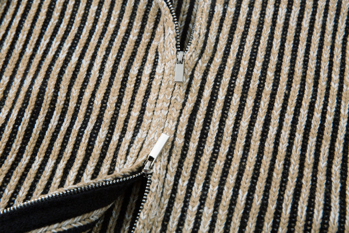 Close-up of the front zipper on the striped ribbed knit jacket