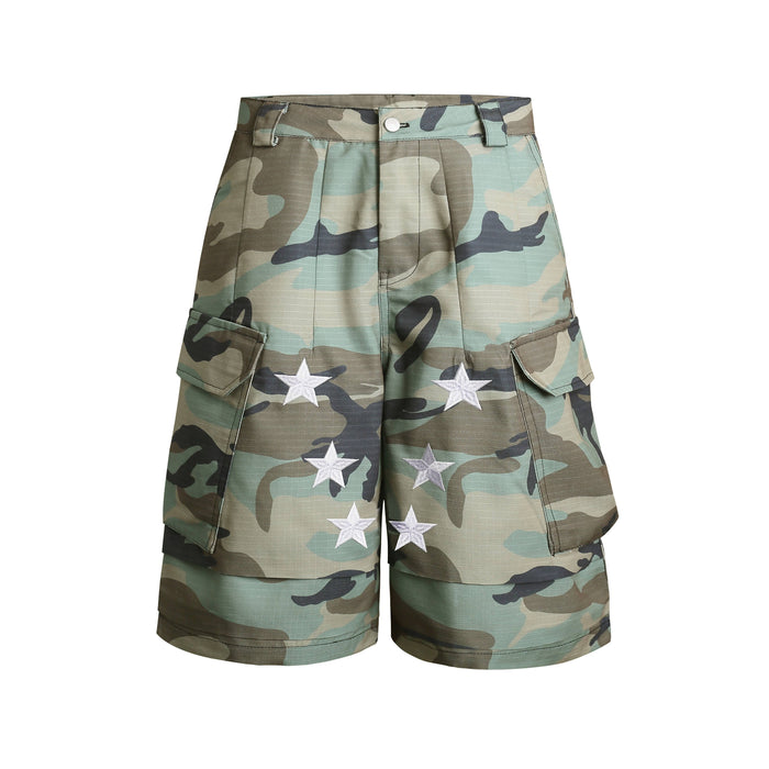 Front view of woodland camo cargo shorts with white star patches and flap pockets