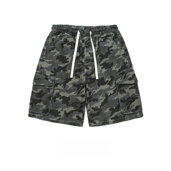 Men's dark grey and black woodland camo cargo shorts with elastic drawstring waist and oversized flap pockets on a white background