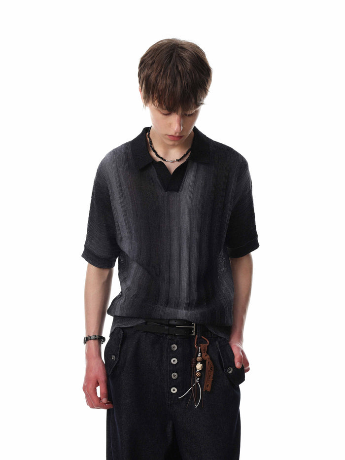 Black open-knit polo shirt with subtle gradient stripes, worn with a relaxed fit and short sleeves on a male model