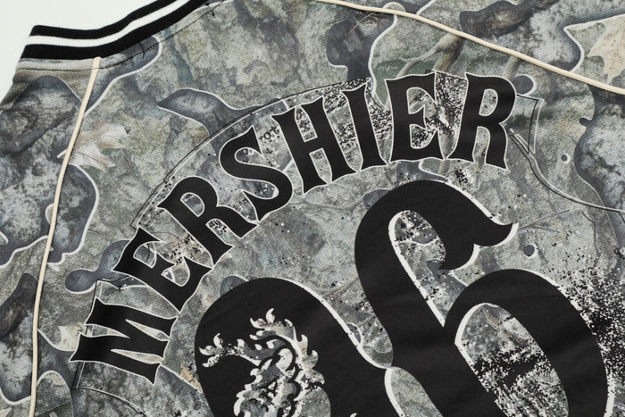 Close-up of back graphic reading Mershier over large 06 on camo jersey