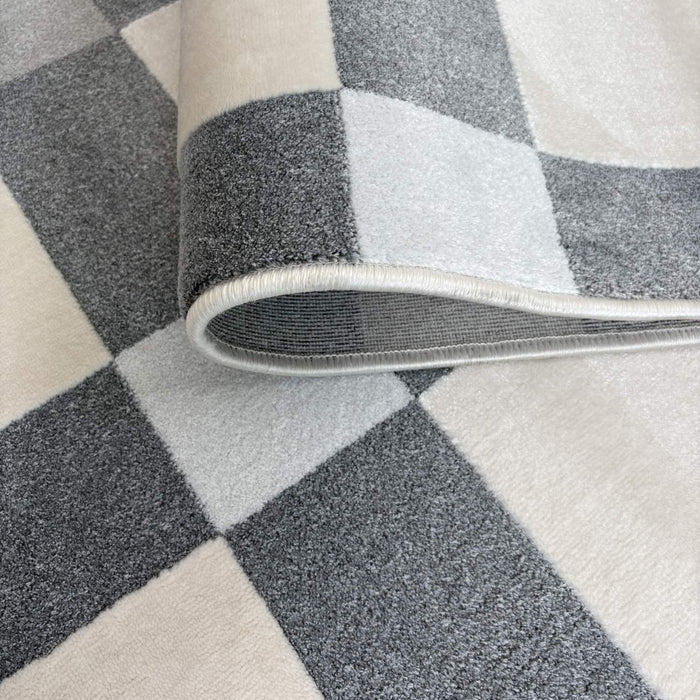 Roll of checkered patterned carpet with gray and white colors