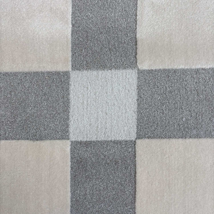 Close-up of a checkered pattern with shades of gray and beige.