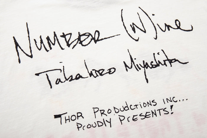White Number (N)ine graphic T-shirt with handwritten black script print and art streetwear design