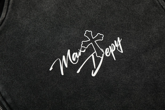 Close-up of white script logo print on black hoodie chest