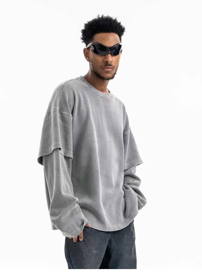 Gray crewneck sweatshirt worn on model in three-quarter front view