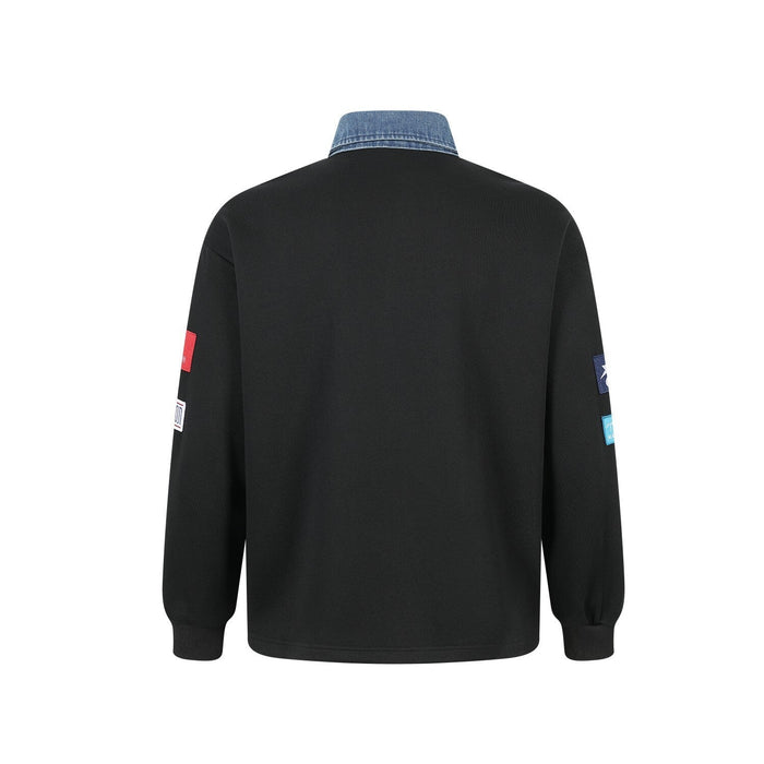Back view of black patchwork polo sweatshirt with denim collar and long sleeves