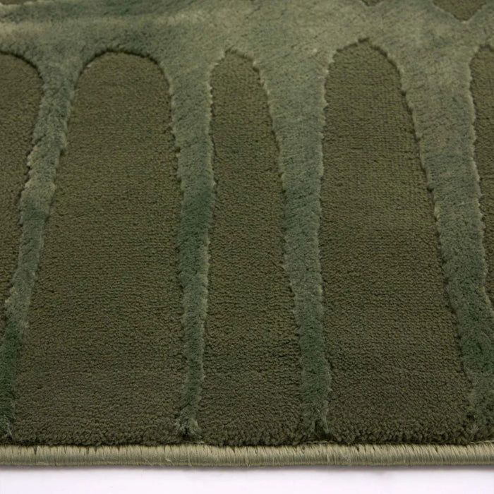 Close-up of a green textured patch on a white background