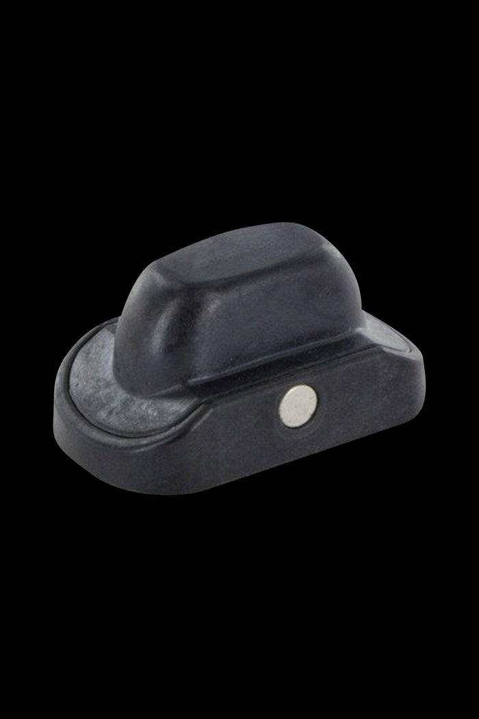 Black cannabis oil concentrate container with a silver button.
