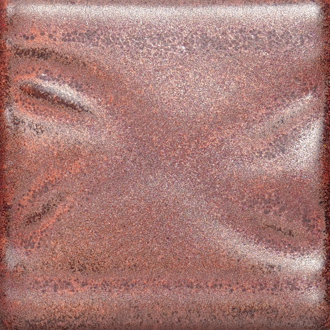 PC-56 Ancient Copper glaze test tile, iridescent pinkish-copper surface over raised texture