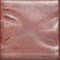 PC-56 Ancient Copper glaze test tile, iridescent pinkish-copper surface over raised texture