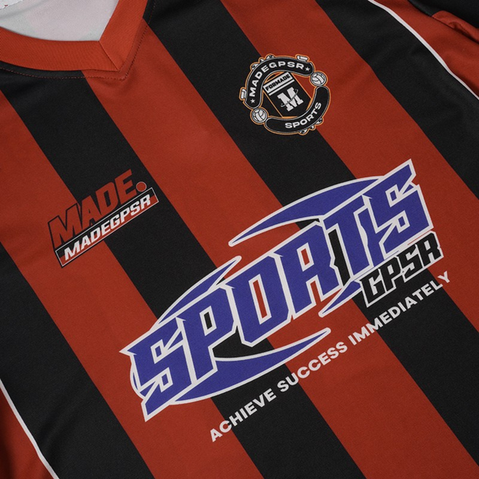 Black and red striped football jersey with bold blue sport graphic and MADEGPSR chest logo