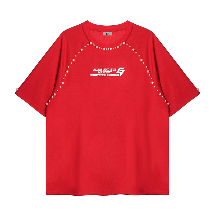 Red studded raglan graphic tee with pearl accents and bold chest print on a streetwear cotton shirt