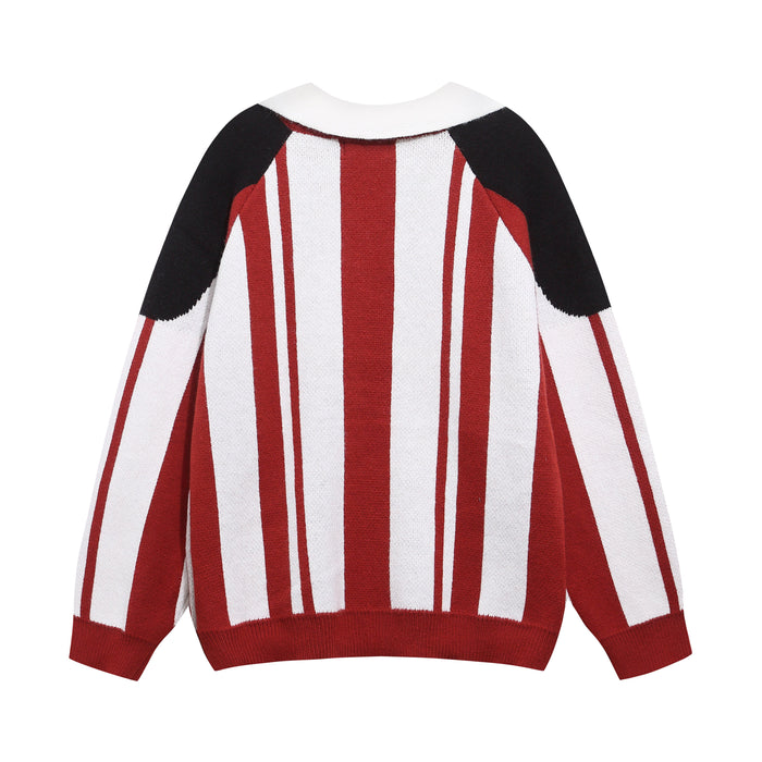 Red and white striped knit sweater with black shoulder panels, front view