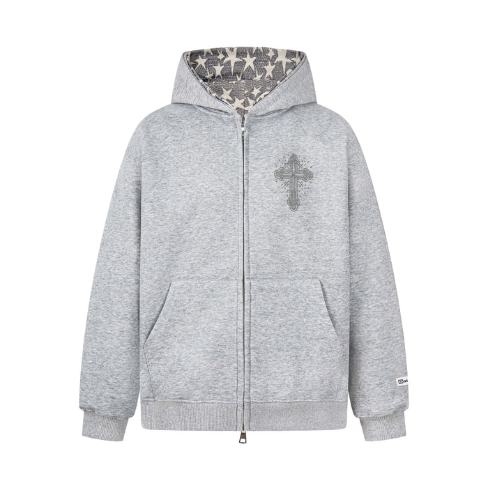Light gray zip hoodie with rhinestone cross on chest and star-print hood lining, front view