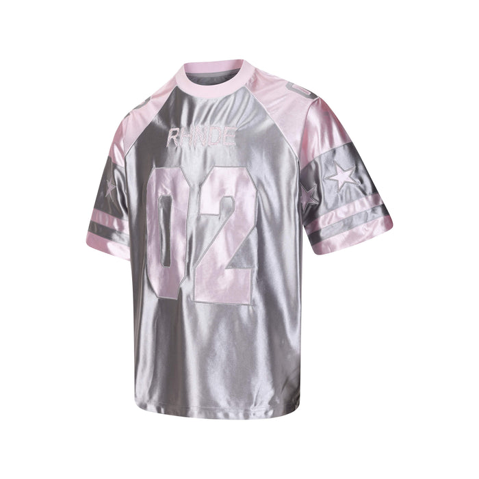 Metallic pink and silver oversized varsity jersey tee with RHNDE 02 graphic and star sleeve details