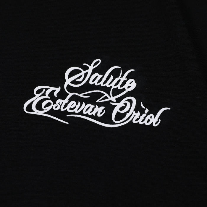 Black oversized tee with white Saludo Estevan Oriol script graphic on the front