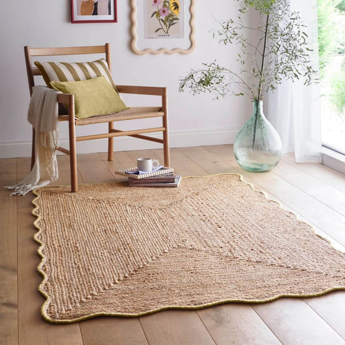 Woven jute rug on a wooden floor with a chair and decorative elements.